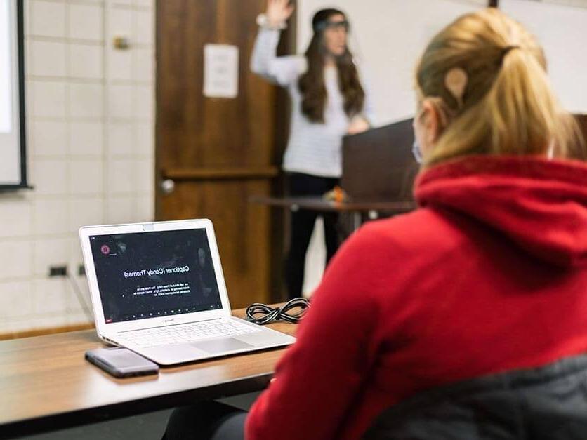 A student utilizes a computer translator.